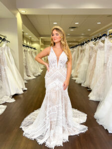 fringe and geometric lace on this fitted lace wedding dress with a deep v neckline and tank straps